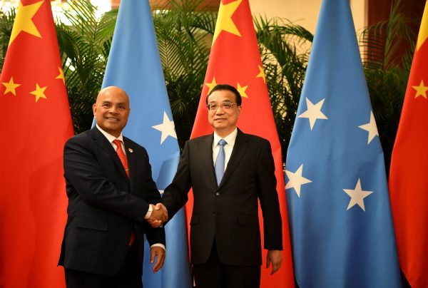China’s Premier Li Keqiang shakes hands with Micronesia's President David Panuelo at the Great Hall of the People in Beijing, China, 13 December 2019 (Photo: Noel Celis/Pool via Reuters).