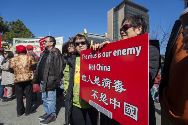People participate in a rally in support of Chinese American and Chinese people and people around the world in fighting the novel coronavirus, COVID-19, in Chinatown, San Francisco, California, United States, 29 February 2020 (Photo: Yichuan Cao/Sipa USA).
