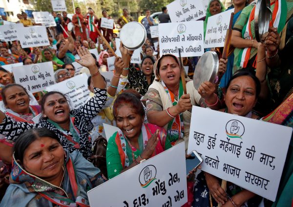 Supporters of India's main opposition Congress party shout slogans during a protest against inflation in Ahmedabad, India, 2 March 2020 (Photo: Reuters/Amit Dave).