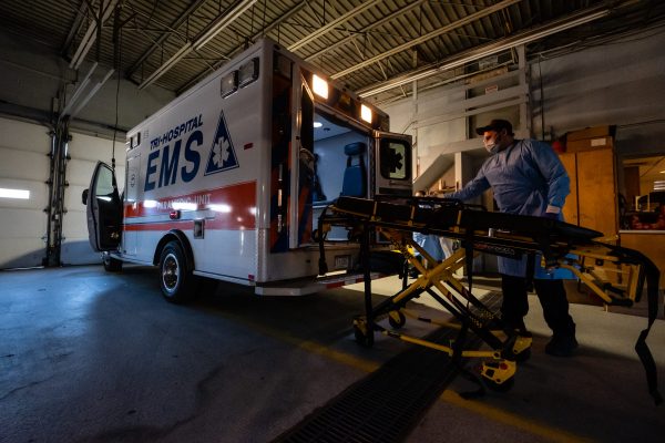 Tri-Hospital EMS Paramedic Jason Burdeaux disinfects a stretcher behind an ambulance in the Tri-Hospital EMS garage in Port Huron, Michigan, United States, 3 April 2020 (Photo: Reuters/ Brian Wells).