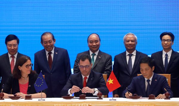European Commissioner for Trade Cecilia Malmstrom, Romania's Business, Trade and Enterpreneurship Minister Stefan Radu Oprea and Vietnam's Industry and Trade Minister Tran Tuan Anh attend the signing ceremony of EU-Vietnam Free Trade Agreement at the government office in Hanoi, Vietnam, 30 June 2019 (Photo: Reuters/Kham).