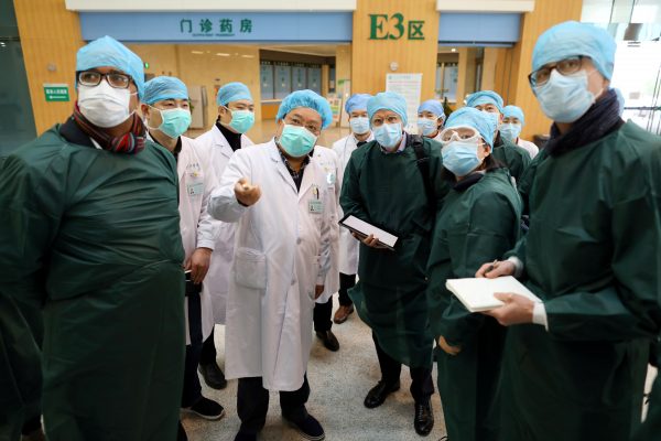 Experts from China and the World Health Organization (WHO) joint team wearing face masks visit the Wuhan Tongji Hospital in Wuhan, the epicentre of the novel coronavirus outbreak, in Hubei province, China 23 February, 2020.