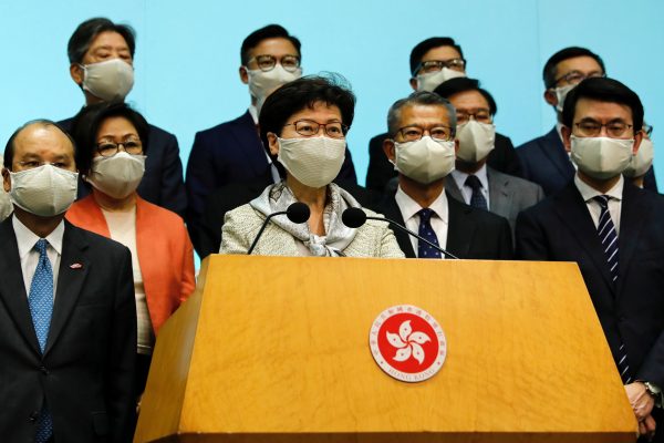 Hong Kong Chief Executive Carrie Lam, wearing a face mask following the coronavirus disease (COVID-19) outbreak, attends a news conference with officers over Beijing’s plans to impose national security legislation in Hong Kong, China 22 May 2020 (Photo: Reuters/Tyrone Siu).