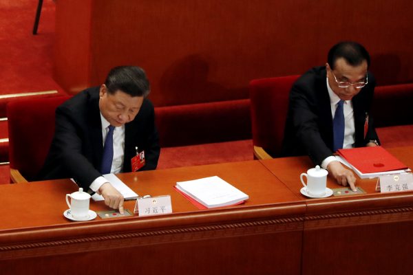 Chinese President Xi Jinping and Premier Li Keqiang cast their votes on the national security legislation for Hong Kong Special Administrative Region at the closing session of the National People's Congress (NPC) at the Great Hall of the People in Beijing, China, 28 May 2020 (Photo: REUTERS/Carlos Garcia Rawlins).
