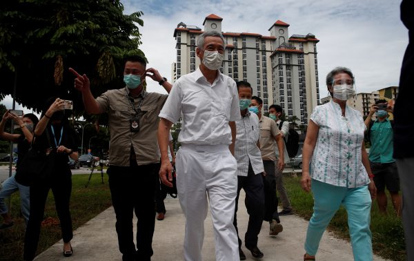 Singapore's Prime Minister Lee Hsien Loong and his wife Ho Ching arrive at a polling station during Singapore's general election amid the COVID-19 pandemic, Singapore, 10 July 2020 (Photo: Reuters/Edgar Su).