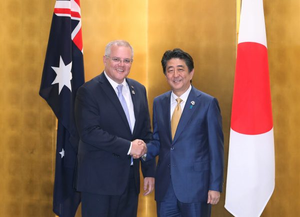 The Prime Minister of Australia Scott Morrison shakes hands with the Prime Minister of Japan Shinzo Abe during a bilateral meeting ahead of the G20 summit in Osaka, Japan, 27 June 2019 (Photo: Reuters/Du XiaoyI)
