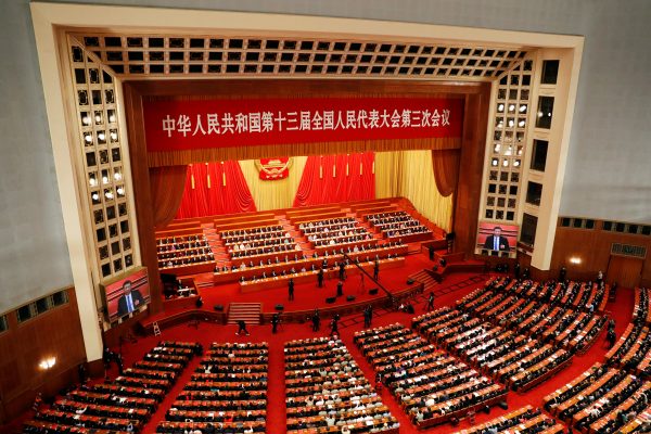 Chinese officials and delegates attend the closing session of the National People's Congress (NPC) at the Great Hall of the People in Beijing, China, 28 May 2020 (Photo: Reuters/Carlos Garcia Rawlins).