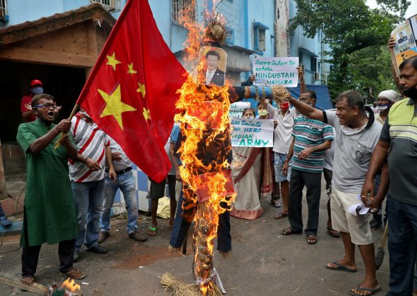 Demonstrators shout slogans as they burn an effigy depicting Chinese President Xi Jinping during a protest against China, in Kolkata, India, 18 June, 2020 (Photo: Reuters/Rupak De Chowdhuri).