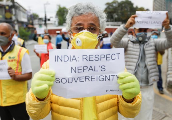 Activists affiliated with 'Human Rights and Peace Society Nepal' protest near the Indian Embassy in Kathmandu against the alleged encroachment of the Nepal border by India, 12 May 2020 (Photo: Reuters/Navesh Chitrakar).