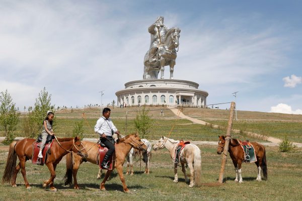 People ride horses near the Genghis Khan Statue Complex, east of Ulaanbaatar, Mongolia (Photo: Reuters/B Rentsendorj).
