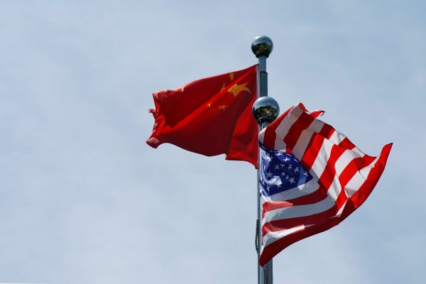 Chinese and US flags flutter near The Bund, Shanghai, China, 30 July 2019 (Photo: Reuters/Aly Song).