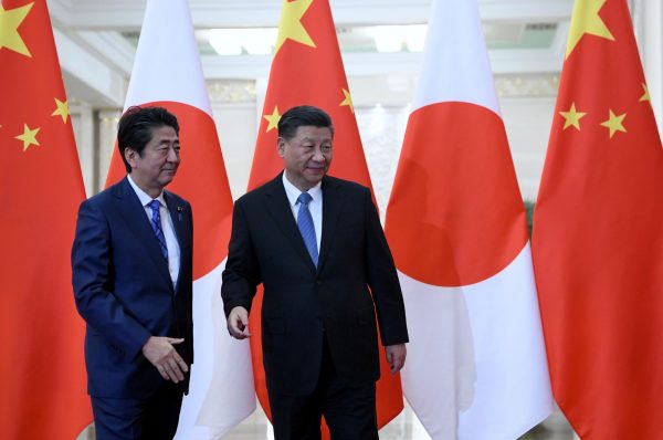 Japan's Prime Minister Shinzo Abe meets with China's President Xi Jinping at the Great Hall of the People in Beijing, China, 23 December 2019 (Photo: Noel Celis/Pool via Reuters).
