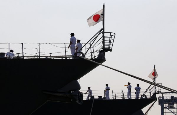 Japan Maritime Self-Defense Force personnel are seen on the destroyers JS Suzutsuki (DD 117) (L) and JS Inazuma (DD 105) as they arrive as part of an Indo-Pacific tour at Tanjung Priok Port in Jakarta, Indonesia, 18 September 2018 (Photo: Reuters/Willy Kurniawan).