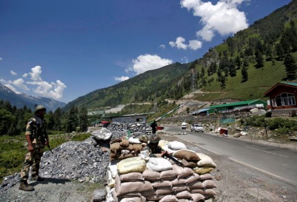 India's Border Security Force (BSF) soldiers stand guard at a checkpoint along a highway leading to Ladakh, at Gagangeer in Kashmir's Ganderbal district, India, 17 June 2020 (Photo: Reuters/Danish Ismail).