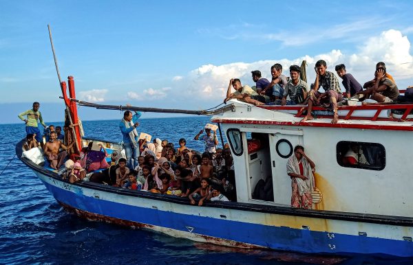 Rohingya refugees are seen on a boat while being rescued by fishermen near the coast of Seunuddon beach in Aceh, Indonesia, 24 June 2020 (Photo: Antara Foto/Rahmad/Reuters).