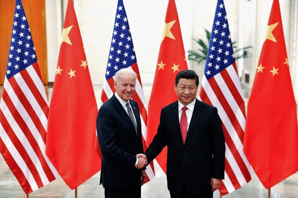 Chinese President Xi Jinping shakes hands with US Vice President Joe Biden inside the Great Hall of the People in Beijing, 4 December 2013 (Photo: Reuters/Lintao Zhang).
