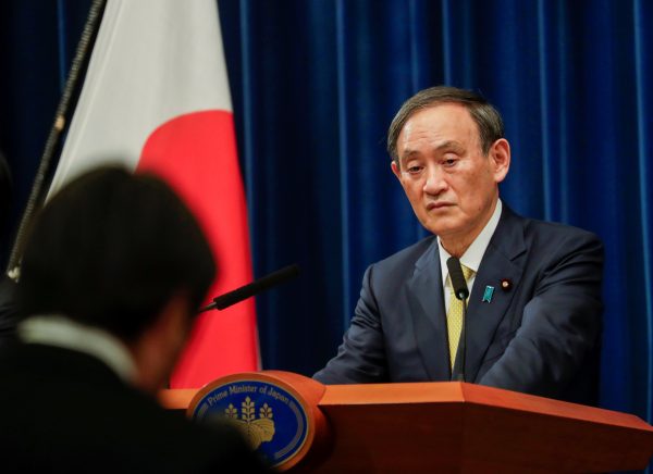 Japanese Prime Minister Yoshihide Suga looks on during a news conference in Tokyo, Japan, 4 December, 2020 (Photo: Hiro Komae/Pool via Reuters).