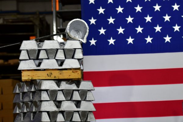 Stacks of aluminum bricks frame a United States flag at Wisconsin Aluminum Foundry in Manitowoc, Wisconsin, 21 September 2020 (Photo: Reuters/Mark Makela).