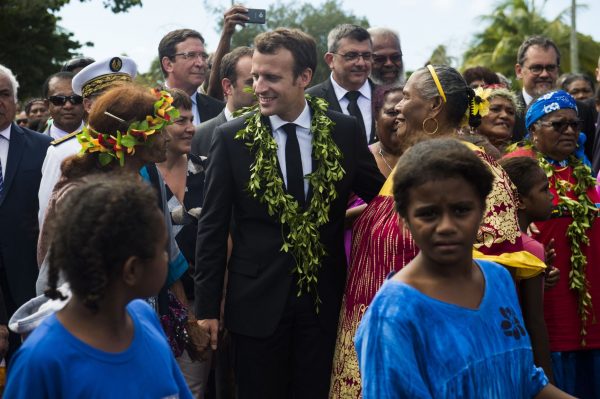 French president Emmanuel Macron walks down a road after a remembrance ceremony at Wadrilla cheffererie on Ouvéa island, New Caledonia, 5 May 2018 (Photo: Reuters/Eliot Blondet).