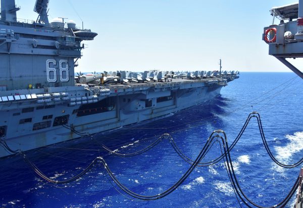 The U.S. Navy aircraft carrier USS Nimitz receives fuel from the Henry J. Kaiser-class fleet replenishment oiler USNS Tippecanoe during an underway replenishment in the South China Sea 7 July, 2020 (Photo: Reuters/US Navy/Christopher Bosch).
