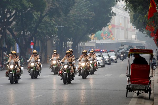 A man cycles on a traditional three-wheeled cyclo around Hoan Kiem lake as security forces patrol ahead of the upcoming 13th national congress of the Communist Party of Vietnam in Hanoi, Vietnam, 20 January 2021 (Photo: Reuters/Kham).