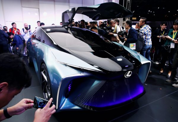 People look and take photos of Lexus' new LF-30 electric vehicle concept car as it is unveiled at the Tokyo Motor Show, in Tokyo, Japan, 23 October, 2019 (Photo: Reuters/Edgar Su).
