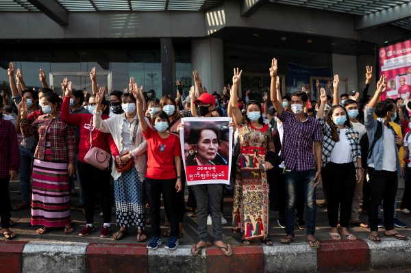 People show the three-finger salute as they take part in a protest against the military coup and to demand the release of elected leader Aung San Suu Kyi, in Yangon, Myanmar, 7 February 2021 (Photo: Reuters/Stringer).