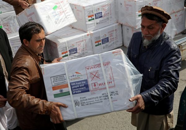 Workers from Afghan health ministry unload boxes containing vials of COVISHIELD, a coronavirus disease (COVID-19) vaccine donated by Indian government in Kabul, Afghanistan 7 February 2021 (Photo: Reuters/Omar Sobhani).