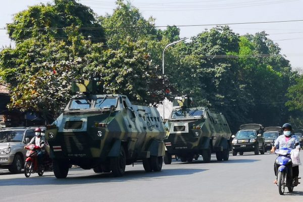 Myanmar Army armoured vehicles drive past a street after they seized power in a coup in Mandalay, Myanmar, 2 February 2021 (Photo: Reuters/Stringer).