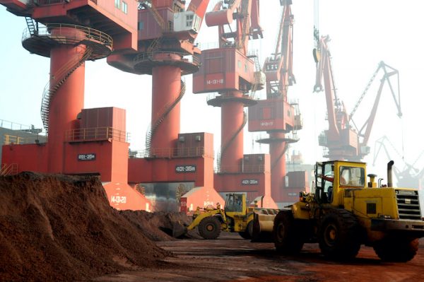 Workers transport soil containing rare earth elements for export at a port in Lianyungang, Jiangsu province, China October 31, 2010 (Photo: Reuters/Stringer).