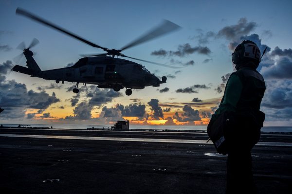 An MH-60R Sea Hawk helicopter launches during flight operations aboard the US Navy aircraft carrier USS Ronald Reagan in the South China Sea , 17 July 2020 (Photo: US Navy/Mass Communication Specialist 2nd Class Codie L Soule/Handout via Reuters).