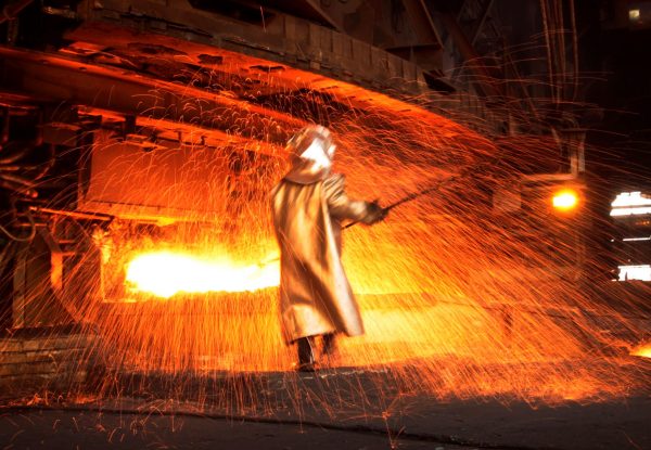 A worker processes nickel, Sulawesi, Indonesia, 8 January 2014 (Photo: Reuters/Yusuf Ahmad).