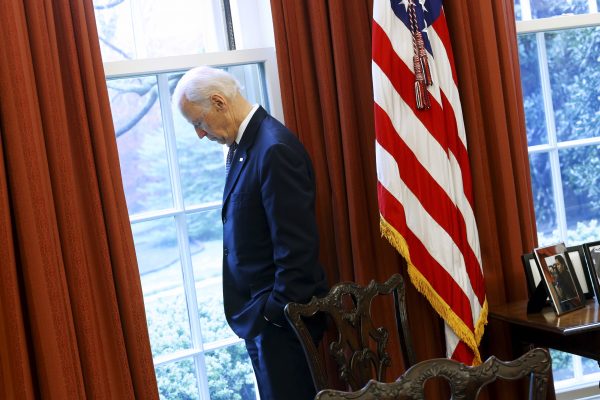 Joe Biden stands at a window looking out to the South Lawn in the Oval Office at the White House in Washington DC, 14 April 2015 (Photo: Reuters/Jonathan Ernst)