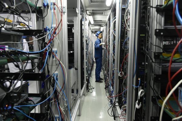 A worker assembles servers on the assembly line of China's Dawning Information Industry Co., also known as Sugon, in Tianjin, China, 14 March 2018 (Photo: Reuters).