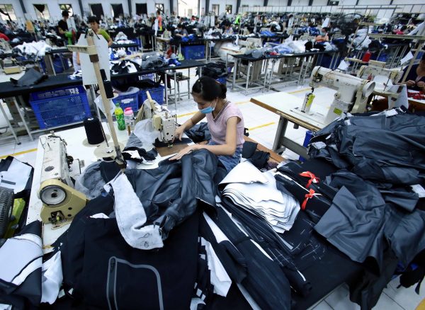 Workers sew clothing at a Vietnamese garment factory in Hung Yen, December 2020 (Photo: Aly Song/Reuters).