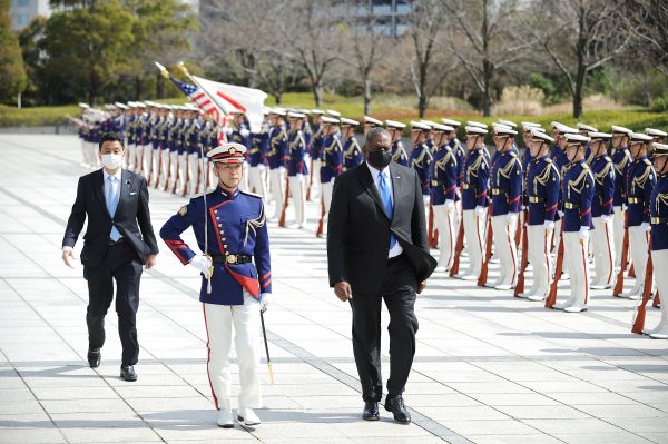 Lloyd Austin, US Secretary of Defense (R) and Japanese Defense Minister Kishi Nobuo (L) attend a review an honour guard prior the US–Japan Defense Ministers Bilateral meeting at the Japan Ministry of Defense, Tokyo, Japan, 16 March, 2021 (Photo: David Mareuil/Pool via Reuters).