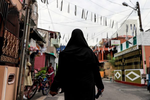 A Muslim woman wearing a hijab walks through a street near St Anthony's Shrine, days after a string of suicide bomb attacks across the island on Easter Sunday, in Colombo, Sri Lanka, 29 April 2019 (Photo: Reuters/Danish Siddiqui).