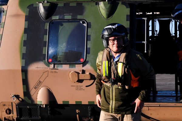 Australian Prime Minister Scott Morrison gets off a helicopter near Sydney, Australia, 24 March 2021 (Photo: Lukas Coch/Pool via Reuters).