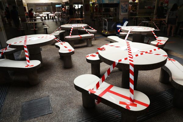 Tables at a hawker center are cordoned off in Singapore, 16 May 2021 (Photo: Reuters/Lionel Ng/ SOPA Images/Sipa USA).