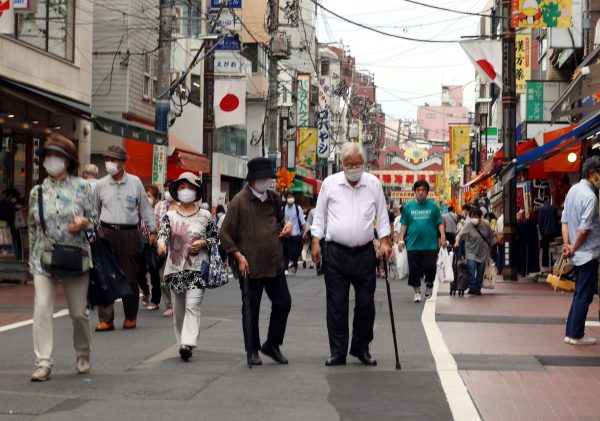 Elderly people stroll at a shopping street in Tokyo's Sugamo district on the Respect for the Aged Day, 21 September 2020 (Photo: Yoshio Tsunoda/AFLO).