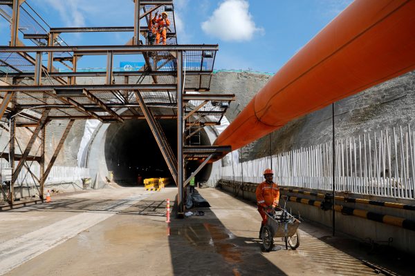 A worker pushes a wheelbarrow at Walini tunnel construction site for Jakarta-Bandung High Speed Railway in West Bandung regency, West Java province, Indonesia, 21 February 2019 (Reuters/Willy Kurniawan).