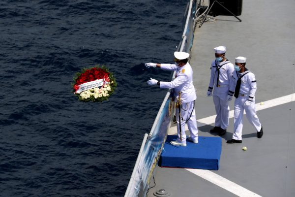 Indonesian Navy Chief of Staff Admiral Yudo Margono throws a wreath from the deck of KRI Dr. Soeharso during a visit at the site of KRI Nanggala-402 submarine's last reported dive, Bali, Indonesia, 30 April 2021 (photo: Reuters/Antara Foto)