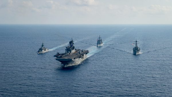 Royal Australian Navy guided-missile frigate HMAS Parramatta (FFH 154) (L) sails with US Navy Amphibious assault ship USS America (LHA 6), Ticonderoga-class guided-missile cruiser USS Bunker Hill (CG 52) and Arleigh-Burke class guided missile destroyer USS Barry (DDG 52) in the South China Sea, 18 April 2020 (Photo: Petty Officer 3rd Class Nicholas Huynh/US Navy/Reuters).