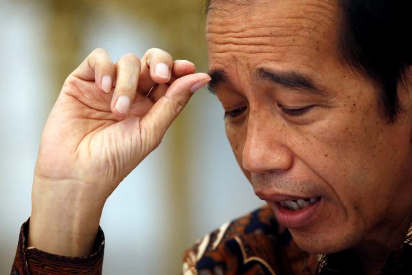 Indonesian President Joko Widodo reacts during an interview with Reuters at the presidential palace in Jakarta, Indonesia, 13 November 2020. (REUTERS/Willy Kurniawan)
