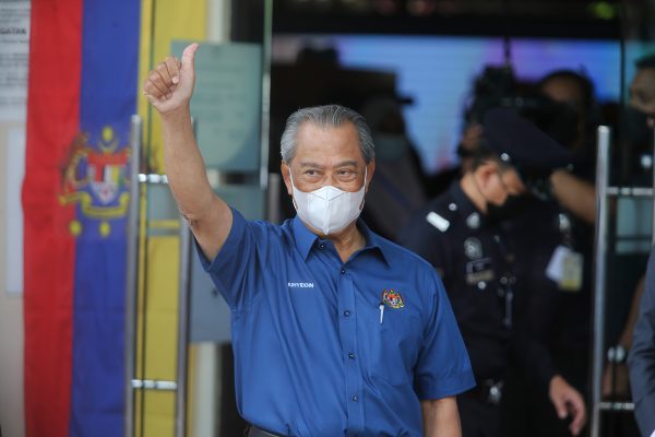 Prime Minister Muhyiddin Yassin raises a thumb on arrival at a health district office for the first dose of Pfizer-BioNTech COVID-19 Vaccine in Putrajaya (Photo: Calvin Pan/SOPA Images/Sipa USA via Reuters).