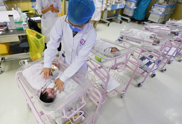 A newborn baby is seen being cared for in the ward of the hospital neonatal care center, 25 April 2021 (Photo by Sheldon Cooper / SOPA Images/Sipa USA)