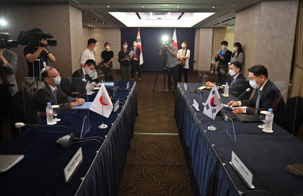 Noh Kyu-duk, South Korea's Special Representative for Korean Peninsula Peace and Security Affairs, talks to Takehiro Funakoshi, Director-General of the Asian and Oceanian Affairs Bureau of the Ministry of Foreign Affairs of Japan, during their bilateral meeting at a hotel in Seoul, South Korea, 21 June 2021 (Photo: Jung Yeon-Je/Pool via Reuters).