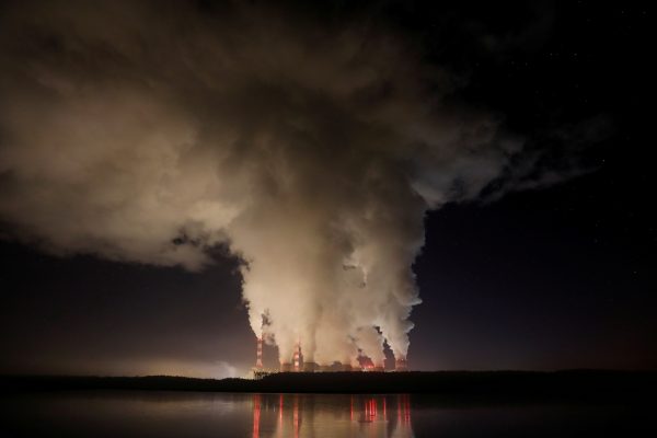 Smoke and steam billows from Belchatow Power Station, Europe's largest coal-fired power plant operated by PGE Group, at night near Belchatow, Poland 5 December 2018 (Photo: Kacper Pempel/Reuters).