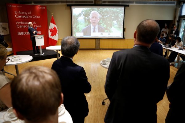 Canadian Ambassador to China Dominic Barton speaks to journalists and diplomats via video link from Dandong, where a local court ruled on the case of Michael Spavor, charged with espionage in June 2019, at the Canadian embassy in Beijing, China, 11 August 2021 (Photo: REUTERS/Florence Lo).