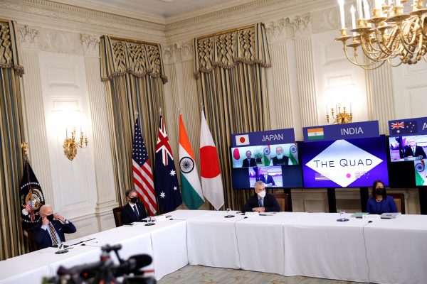 US President Joe Biden and Vice President Kamala Harris, not pictured, participate beside staff and cabinet members in a virtual meeting with Asia-Pacific nation leaders at the White House in Washington, 12 March 2021 (Photo: Reuters/Tom Brenner).